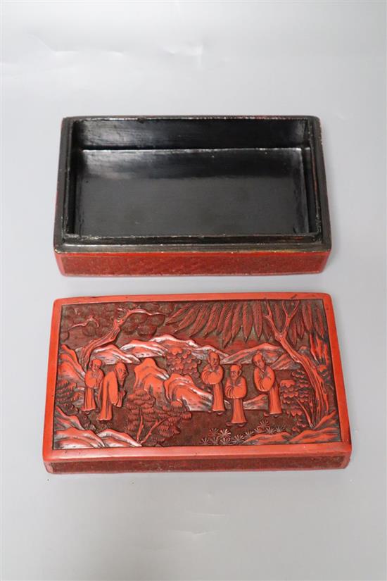 A Chinese cinnabar lacquer box, Qing Dynasty, the cover carved with deity, width 18cm, some restoration